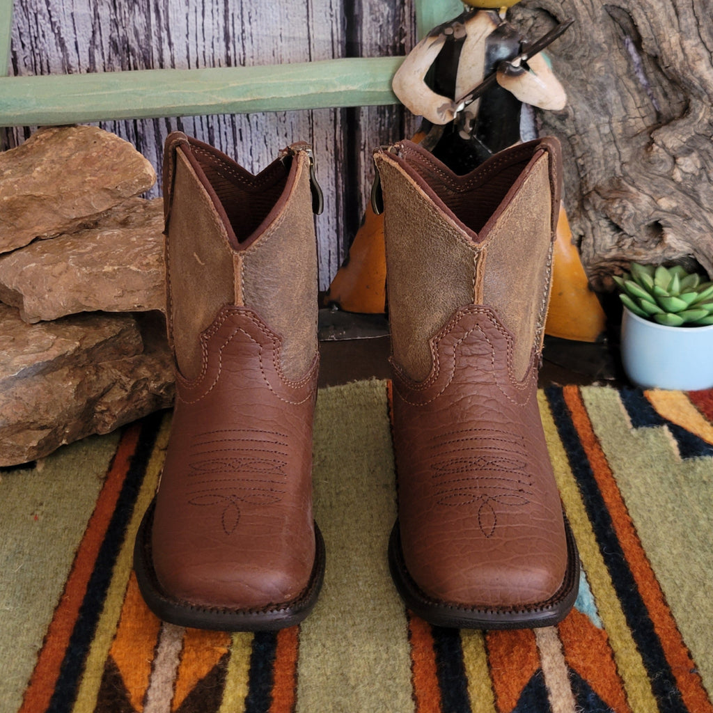 Tan leather booties with a two-tone finish and subtle stitched detailing along the shaft.