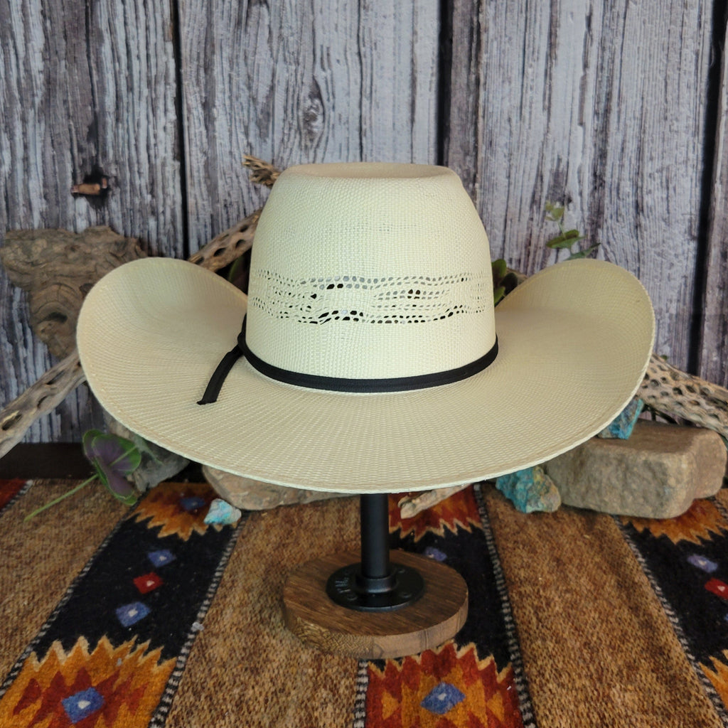 A cream straw rodeo hat with sleek black band.