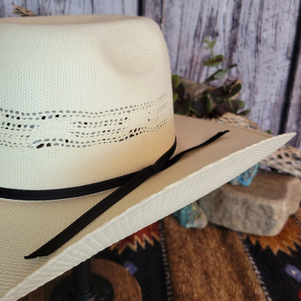 A close-up of the black band's tie and straw weave.