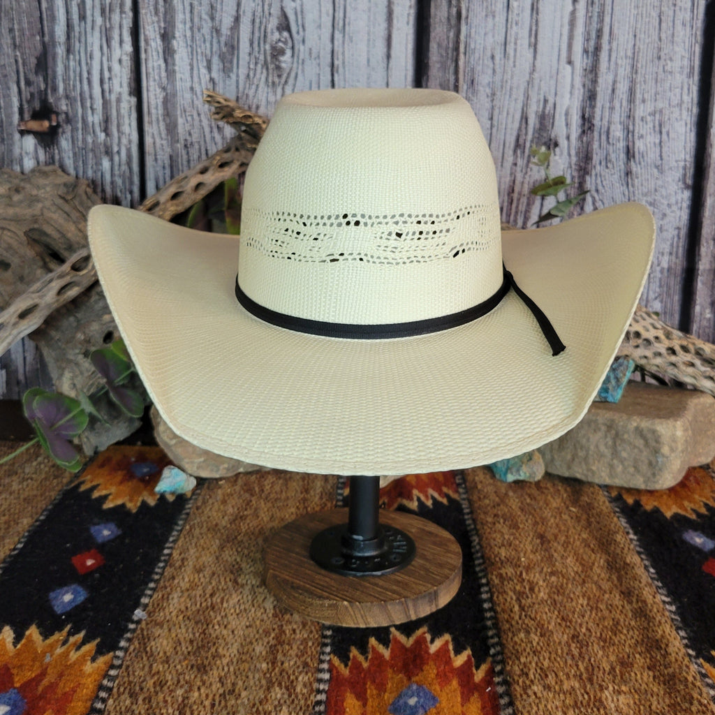 A cream straw rodeo hat with sleek black band.