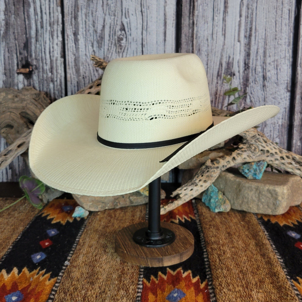 A cream straw rodeo hat with sleek black band.
