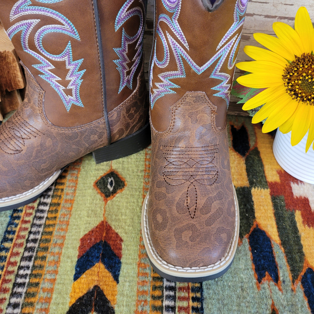 A close up of the leopard print on the front of the boot.