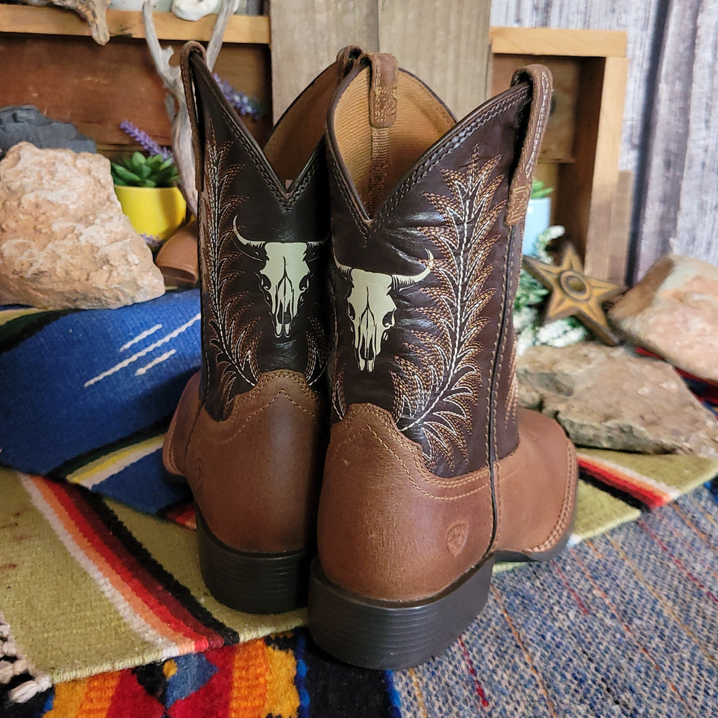 The back of the boots showcase the intricate stitching and cow skull detail.