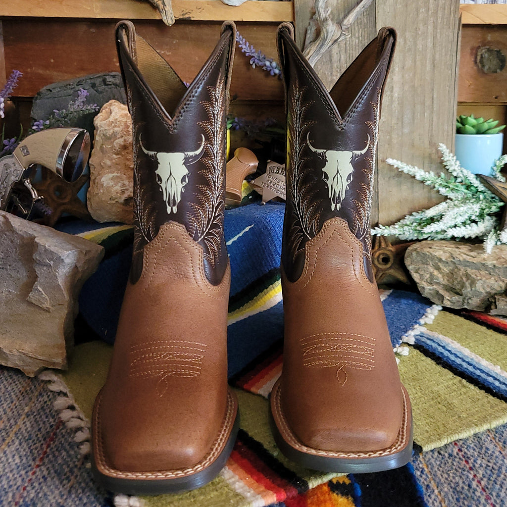 Cowboy boots made from leather with dark brown shaft featuring a cow skull detail.