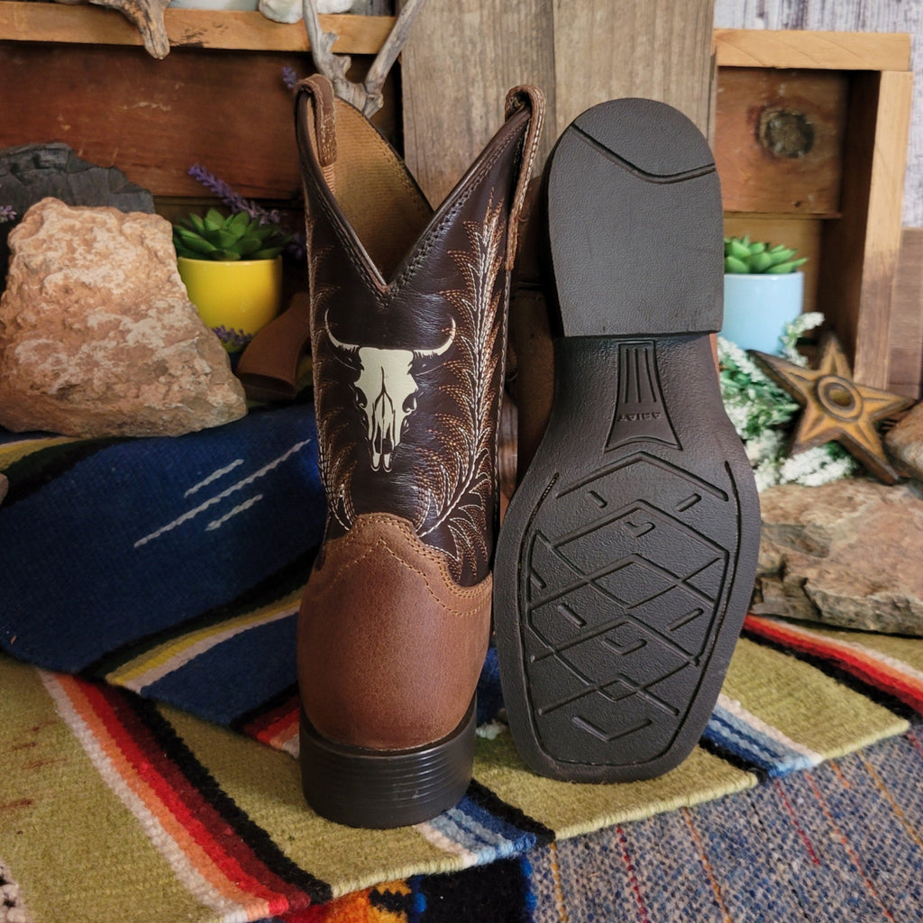 The sole is made from leather and the back of the boot features the cow skull on the shaft.