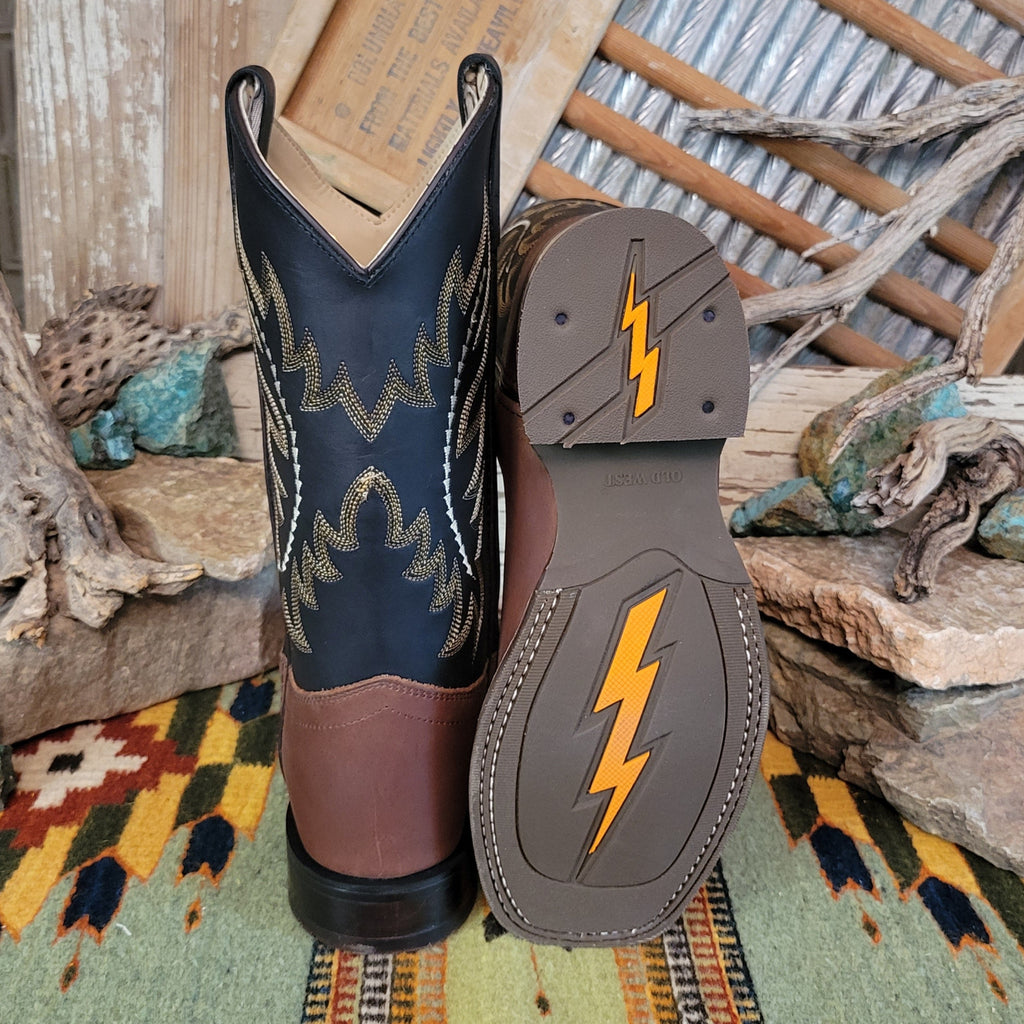 The sole the leather boots, revealing a durable rubber tread and dual lightning bolt design.