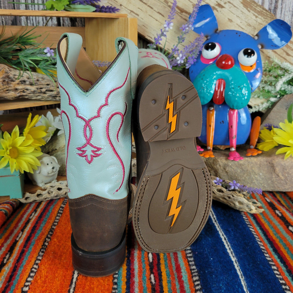 Back of the teal shaft with bright red designs and rubber outsole with orange lightning bolt detail.