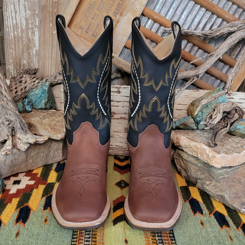 Kids' brown leather boots with black shafts, featuring ornate stitching and a squared toe.