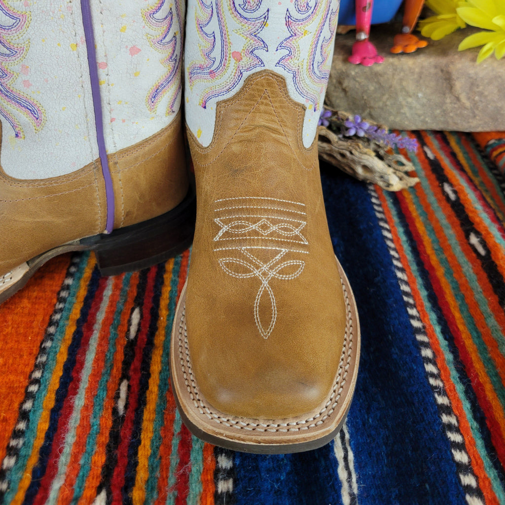 Tan leather toe with white stitching.