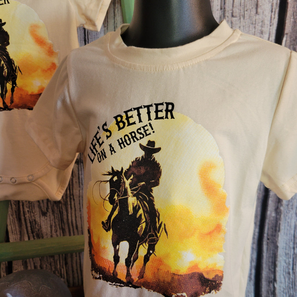 Close-up of the cowboy riding into the sunset with slogan on the front.