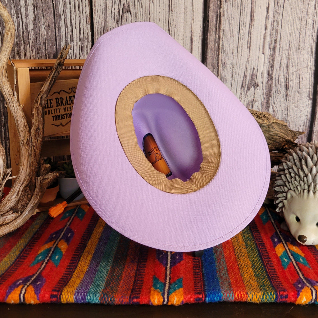 Interior of the purple hat with a tan sweatband.