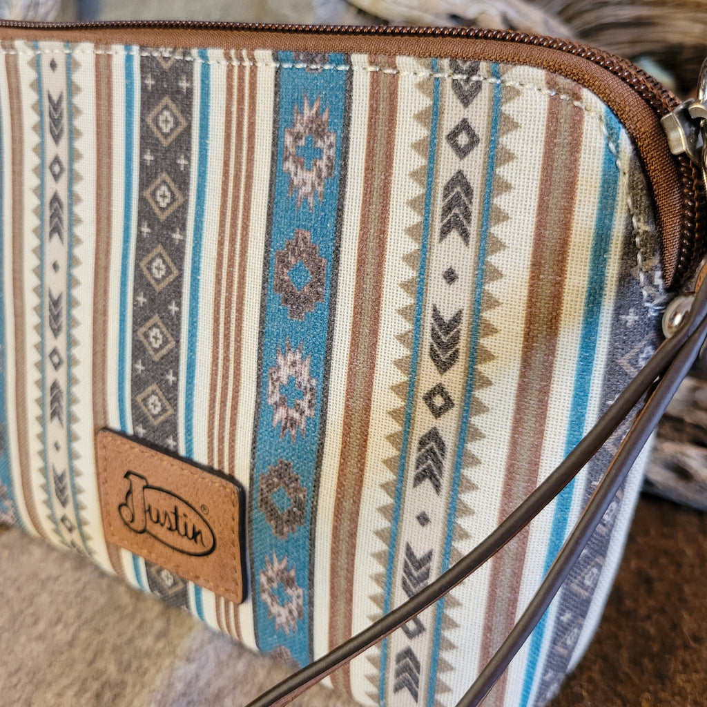 Canvas pouch with cowgirl design and southwestern print.