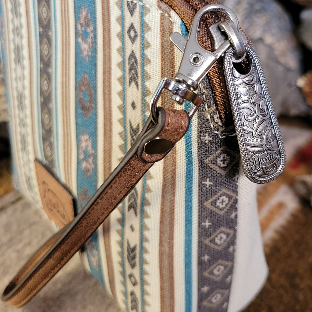 Canvas pouch with cowgirl design and southwestern print.