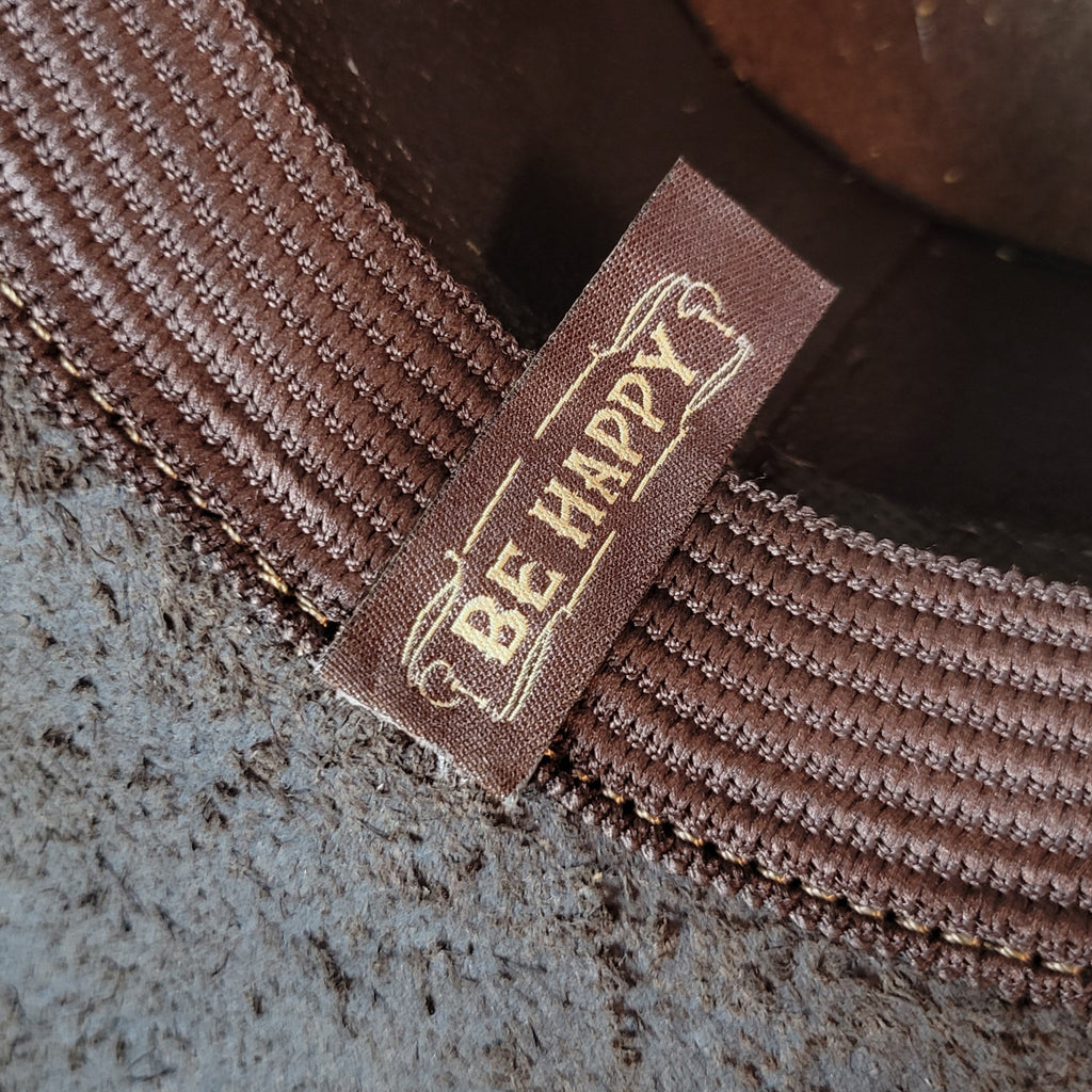 The brand's slogan is featured as a tag on the sweatband.