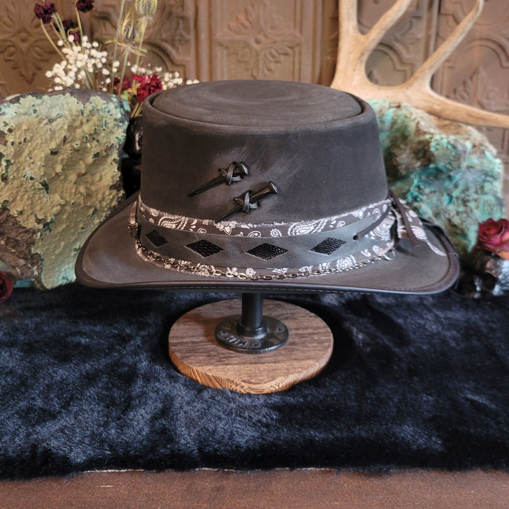 Side view showcases the leather inlays, bandana band, and nails imbedded into the hat.