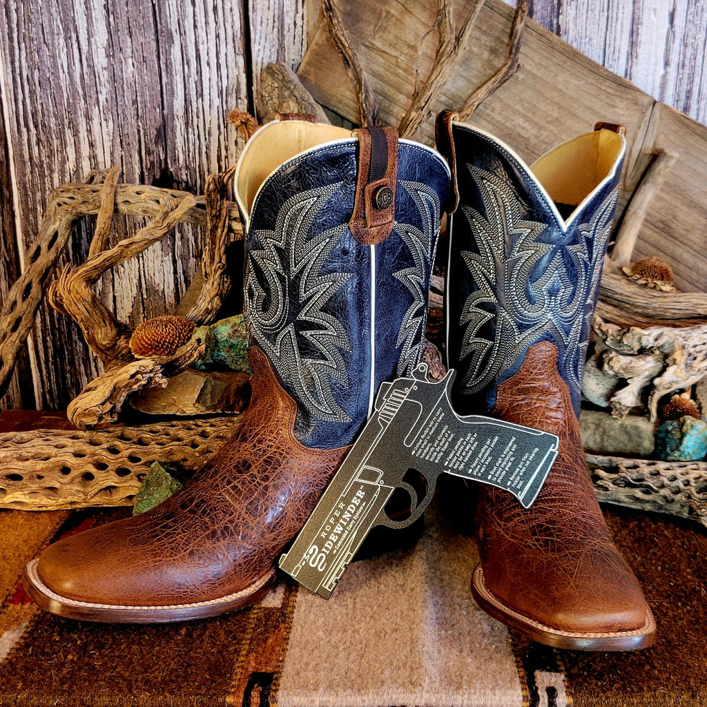 Pair of leather boots with conceal carry capability, blue shaft with detailed stitching, and weathered brown toe.