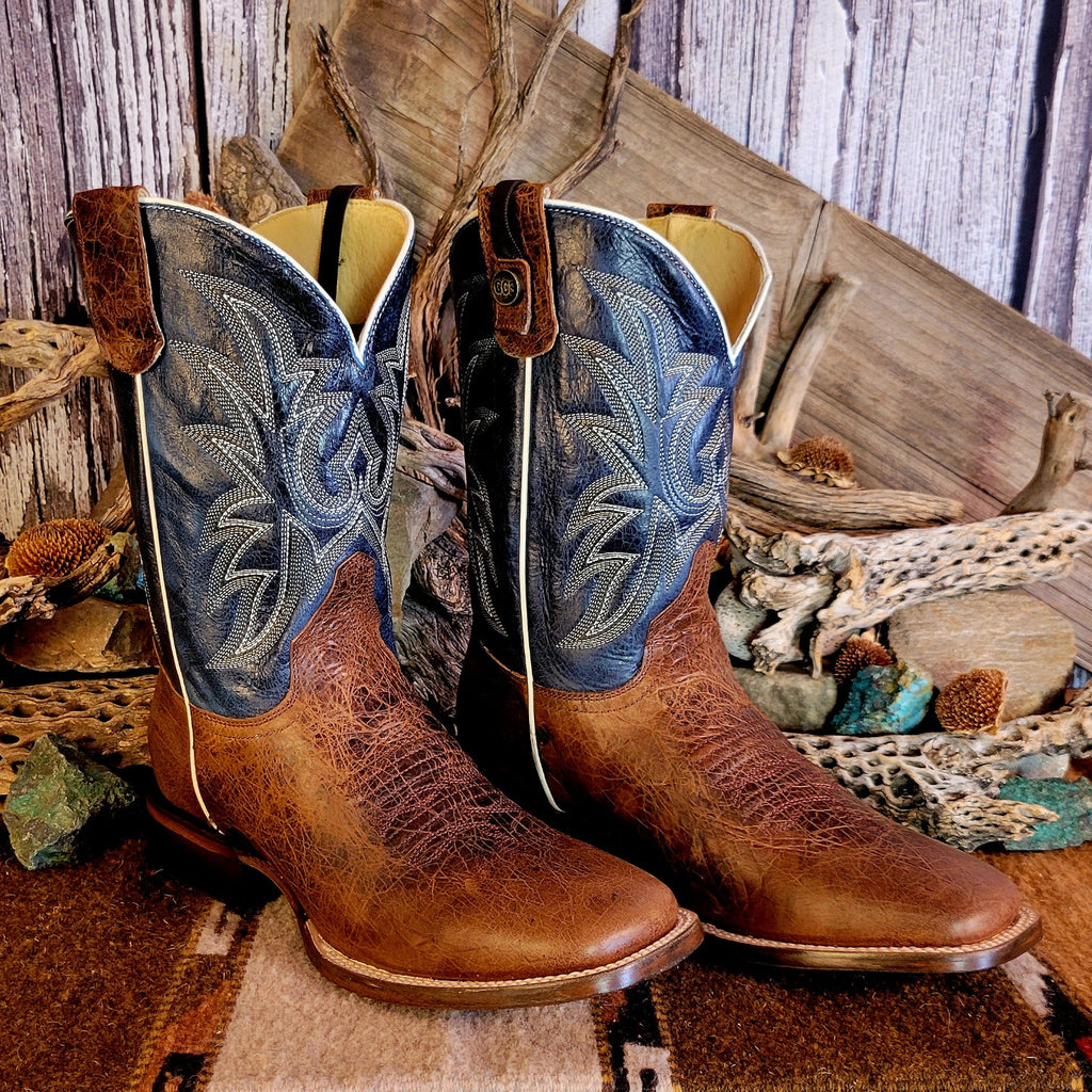 Pair of leather boots with conceal carry capability, blue shaft with detailed stitching, and weathered brown toe.
