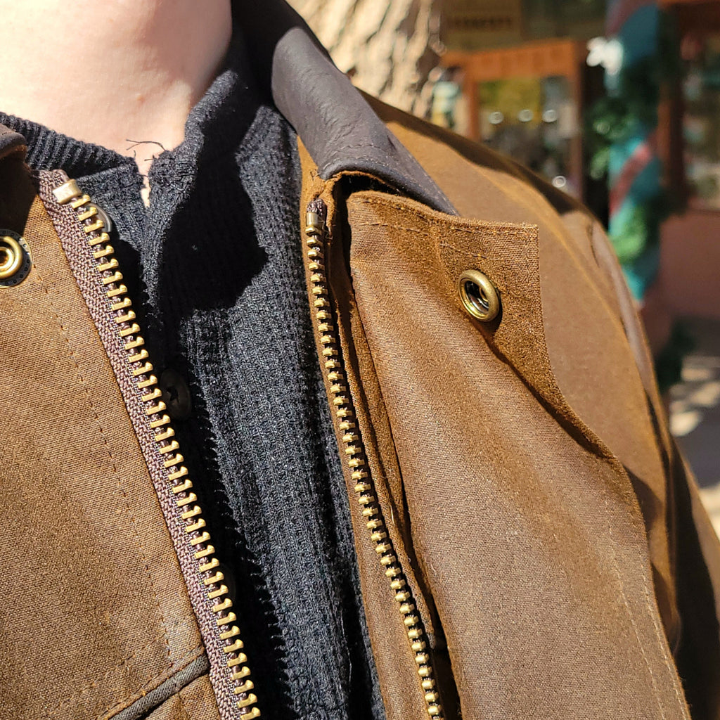 Brown conceal carry jacket with multiple pockets and conceal carry option.