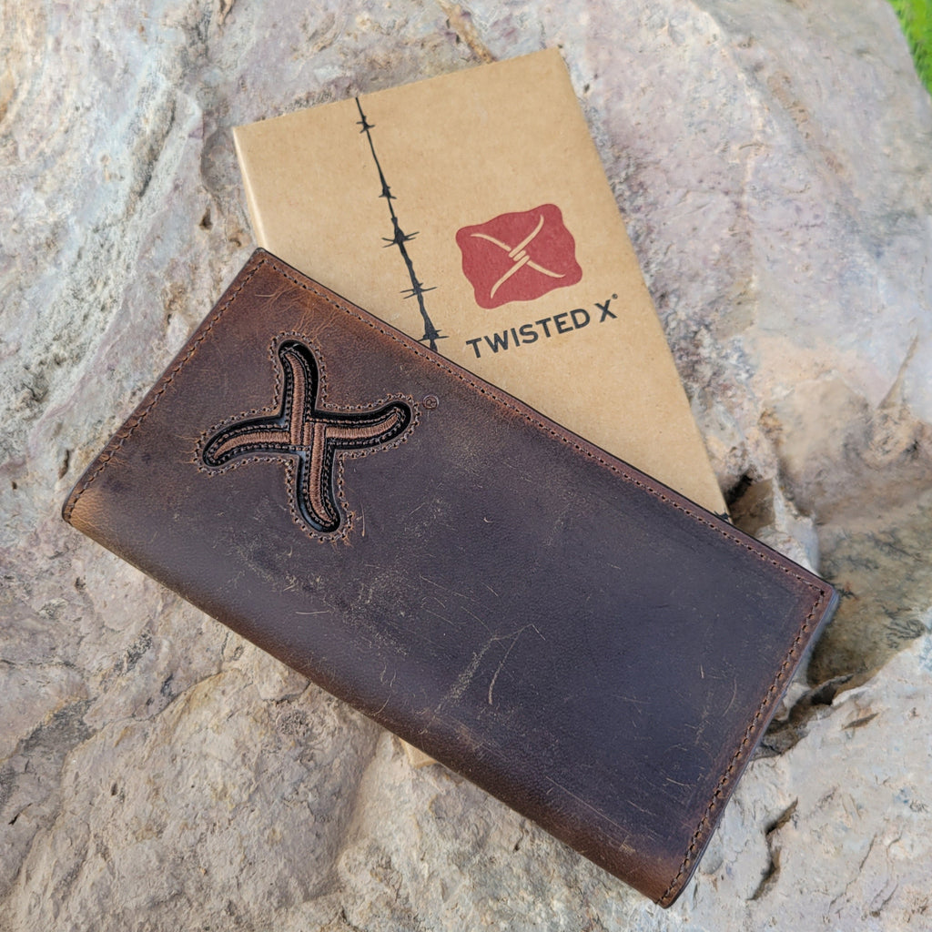 Distressed brown leather bomber rodeo wallet with embroidered twisted X logo on the front.