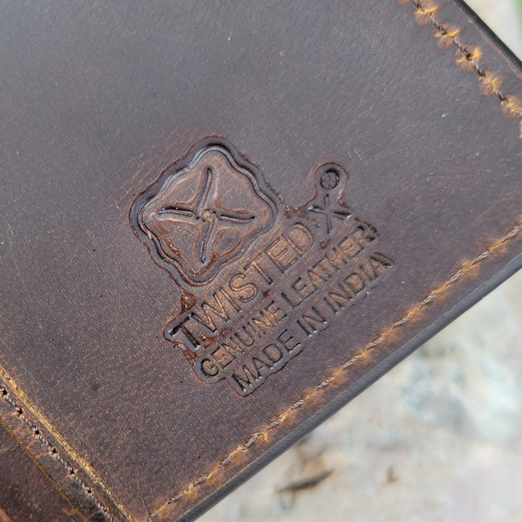 The Twisted X logo is stamped on the interior of the wallet.
