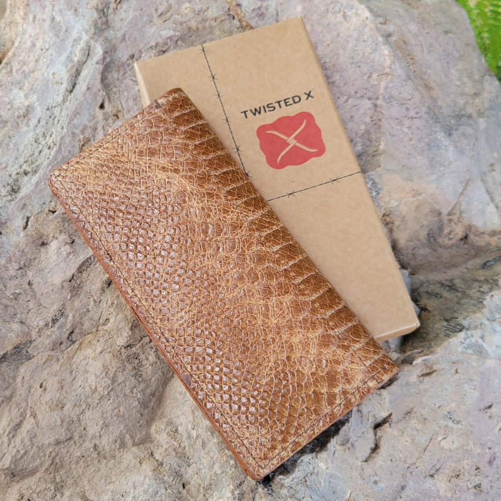 Tan leather rodeo wallet with replicated snake texture.