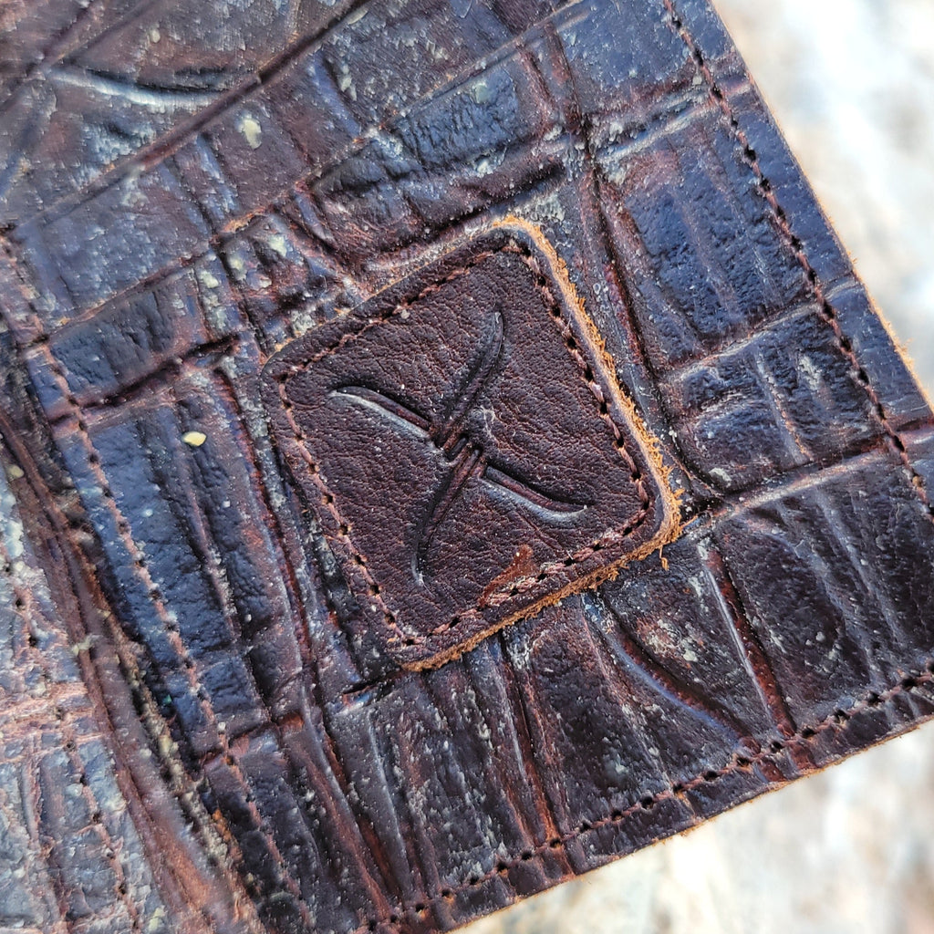 The brand's logo found on the interior of the wallet.