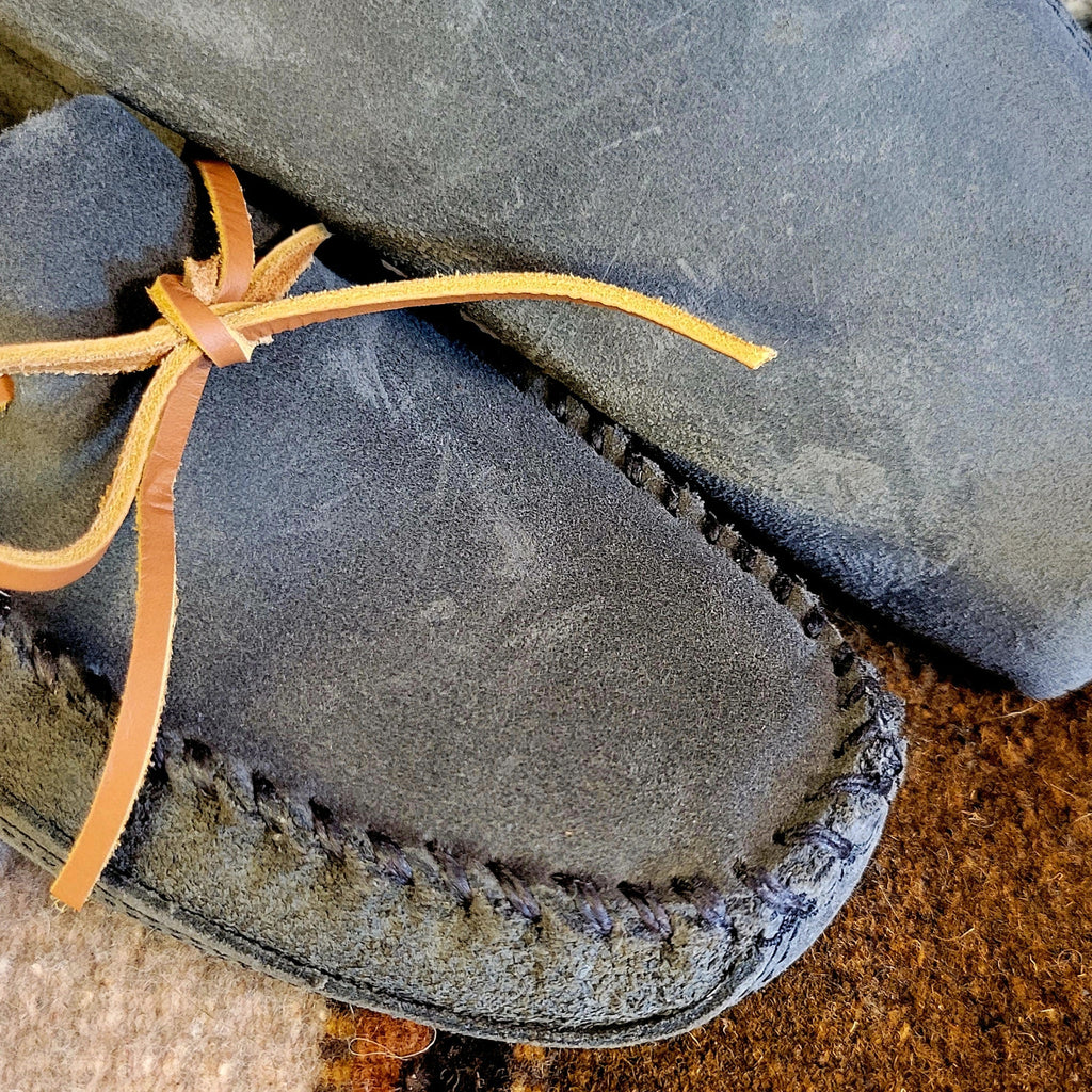 Close-up of the stitching and rawhide laces.