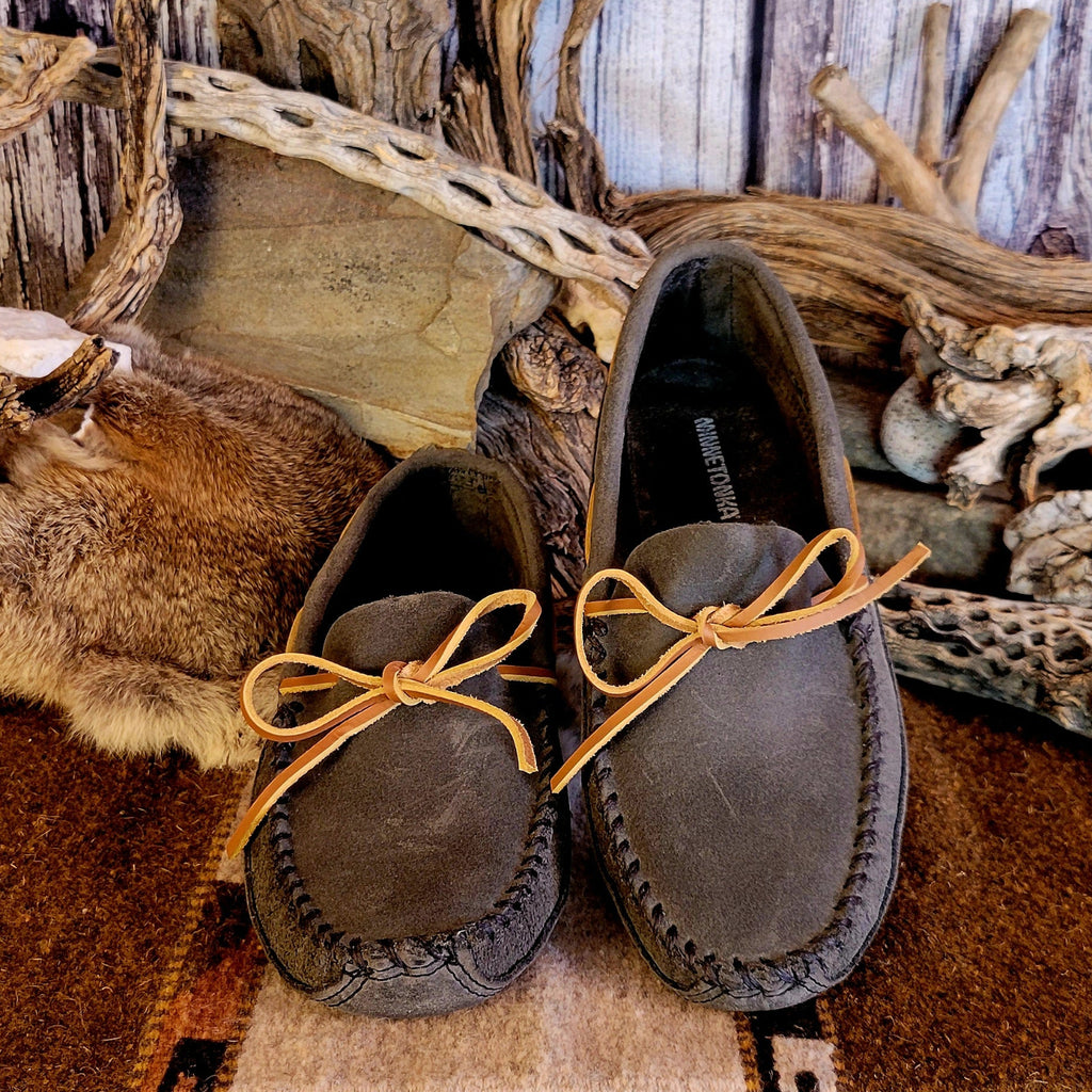 Pair of gray moccasins with rawhide laces.