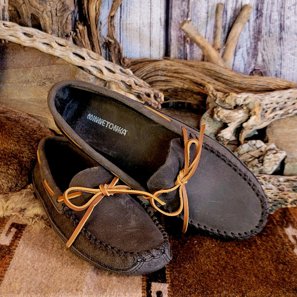 Pair of gray moccasins with rawhide laces.