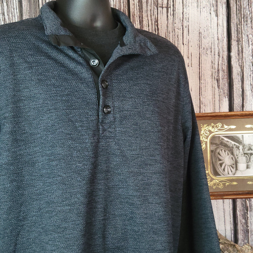 Dark blue sweater with half-button-up design and long sleeves.