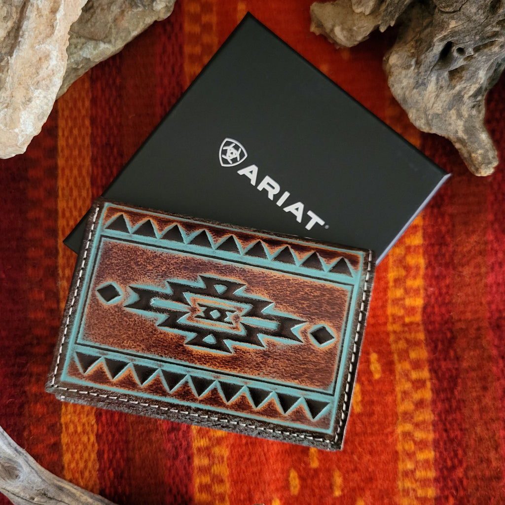 Brown leather trifold wallet with an Aztec design and turquoise accents.