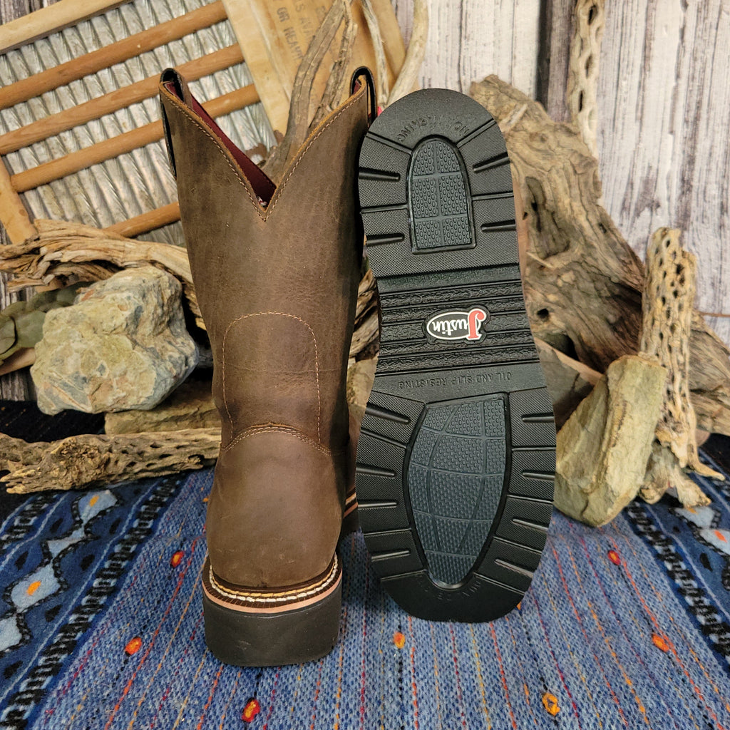 Brown leather boot with weathered finish and rubber sole.