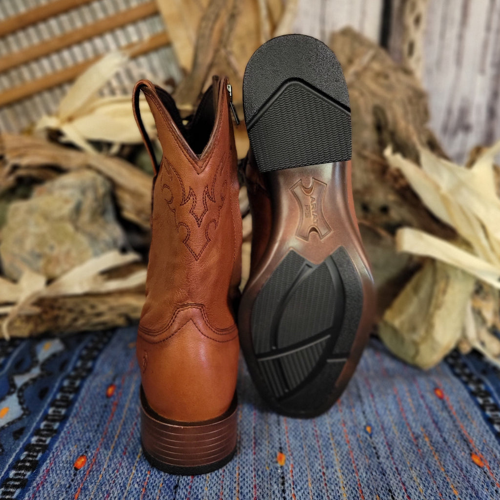 Brown leather boots with zipper shaft and polished appearance with rubber outsole.