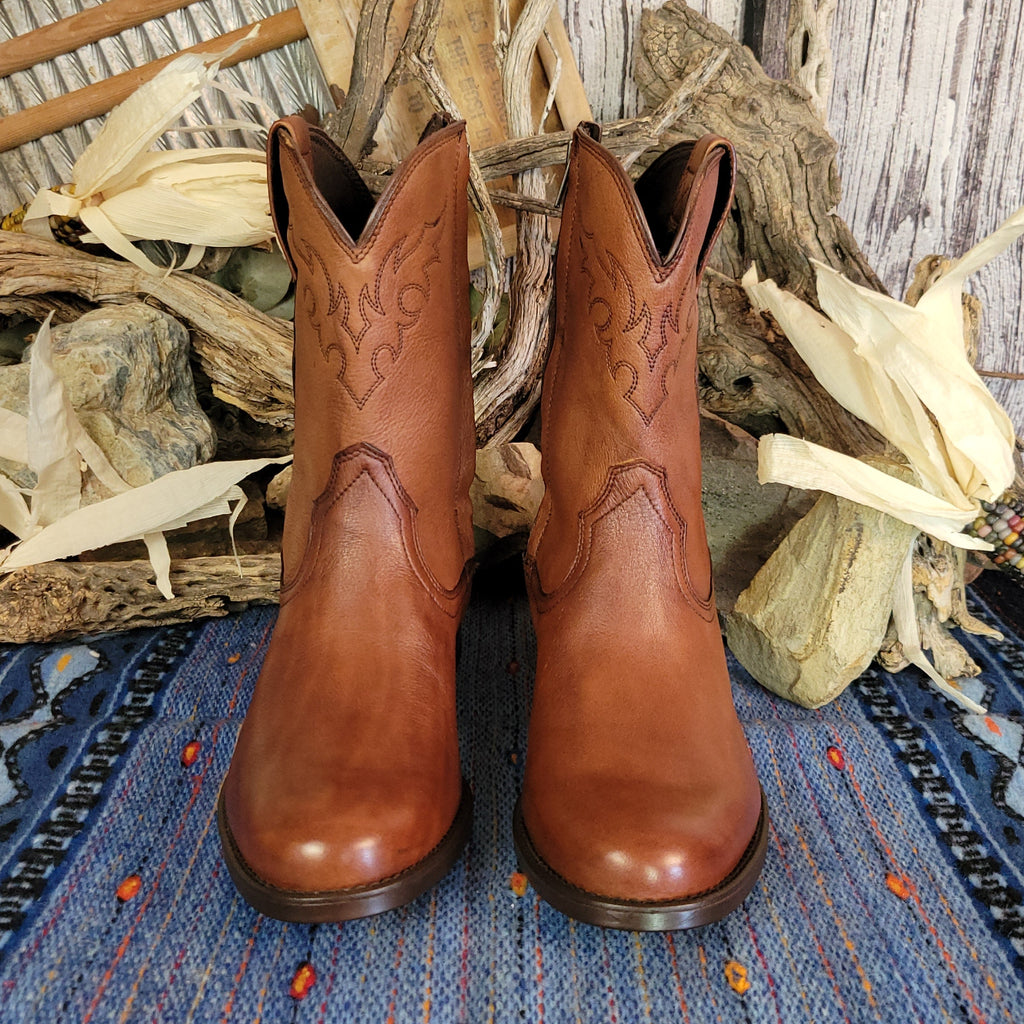 Brown leather boots with zipper shaft and polished appearance.