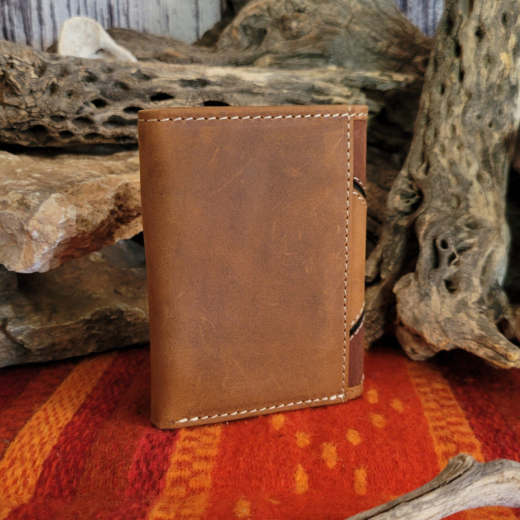 Smooth tan backing with simple stitching on the back of the wallet.