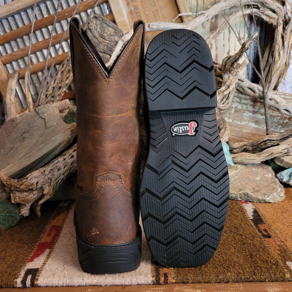 Brown leather boot with weathered appearance and rubber outsole.