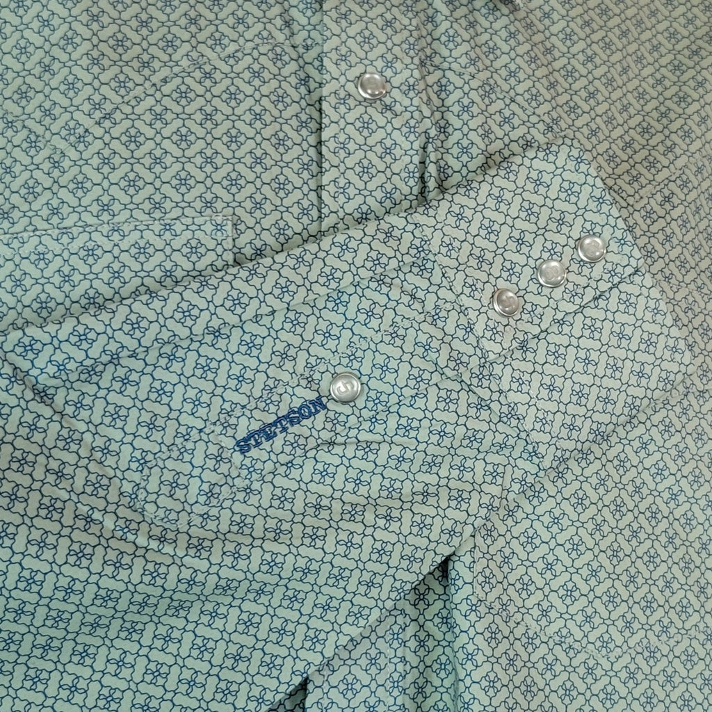 Moss colored shirt with small intricate patterns and pearl snap buttons.