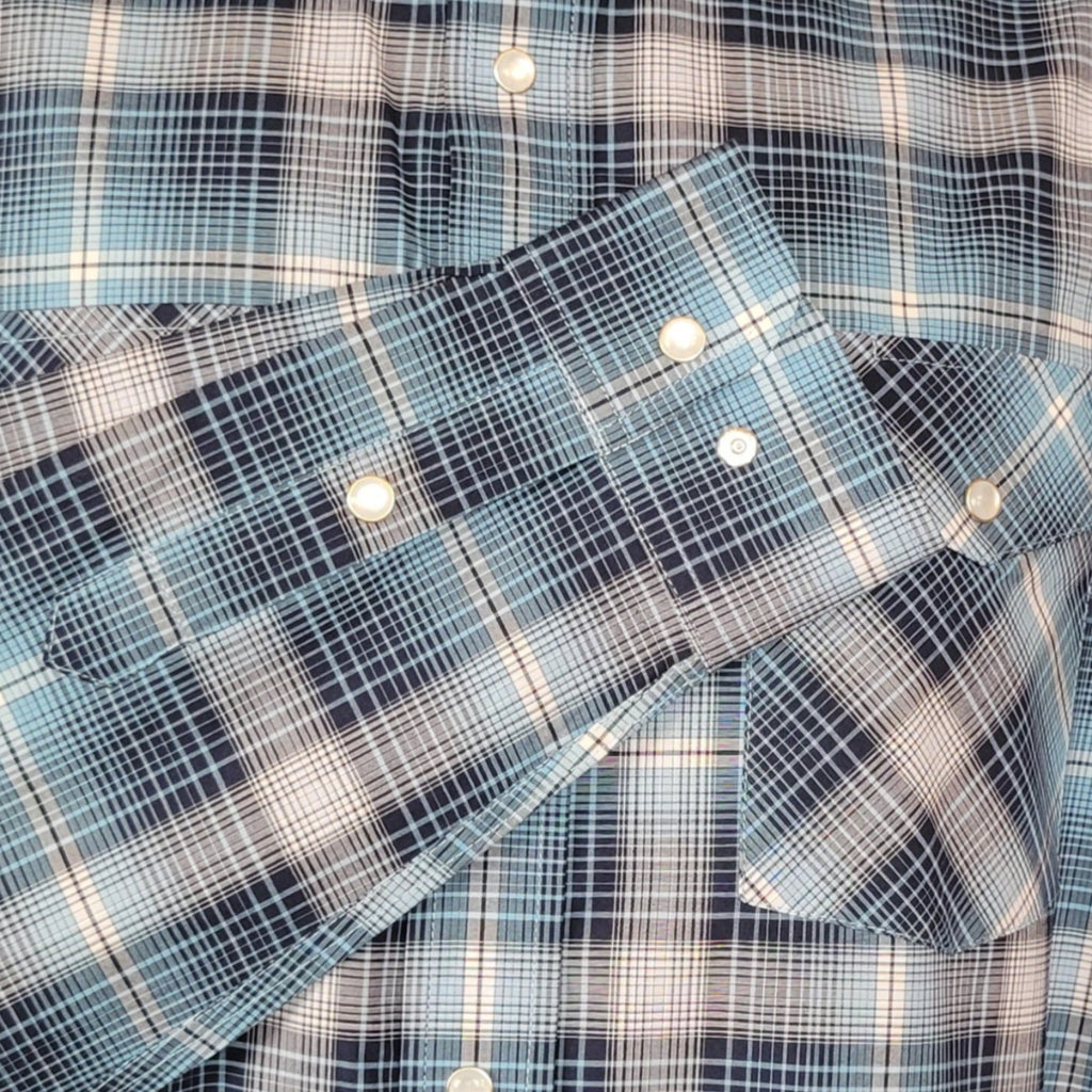Close-up on the white and blue plaid pattern on the sleeve.