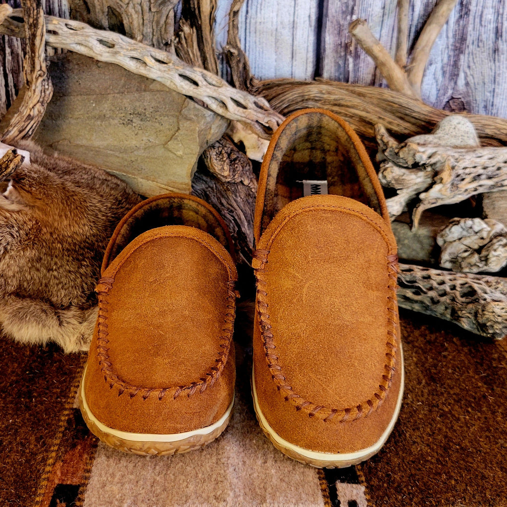 Pair of tan moccasin slippers with plaid, lined interior.
