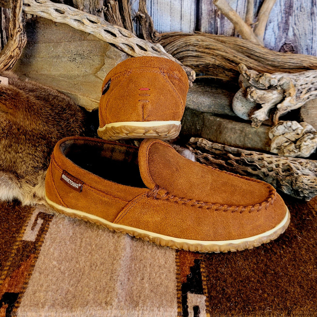 Pair of tan moccasin slippers with plaid, lined interior.
