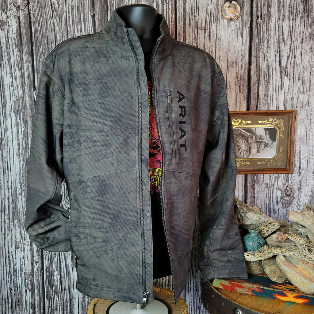 Forest green softshell jacket with patriotic motifs and concealed carry pocket on the interior.