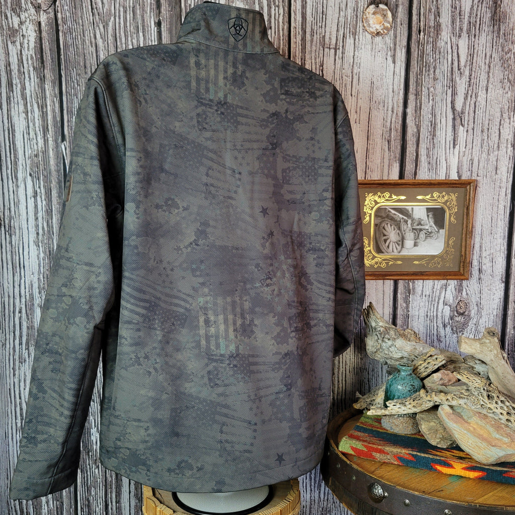 Forest green softshell jacket with patriotic motifs and concealed carry pocket on the interior.