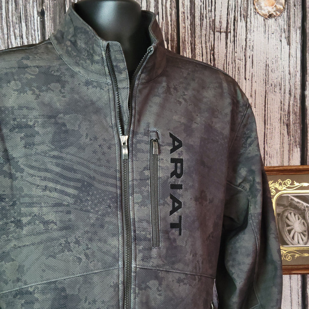 Forest green softshell jacket with patriotic motifs and concealed carry pocket on the interior.