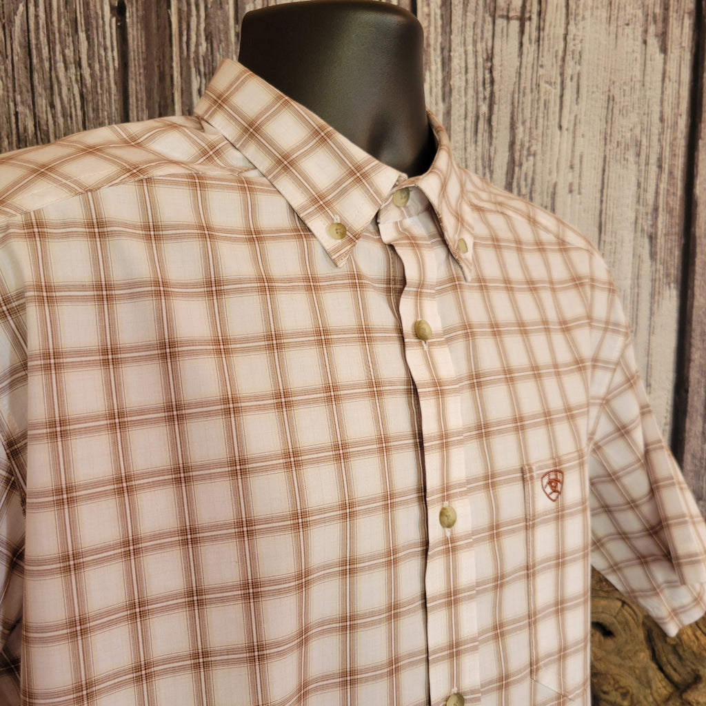 Checkered button down shirt with small embroidered Ariat logo on the pocket.