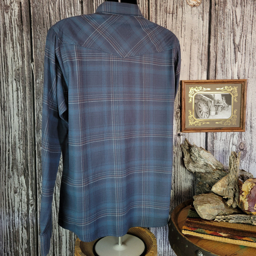 Blue plaid shirt with dual chest pockets and pearl snap closure.