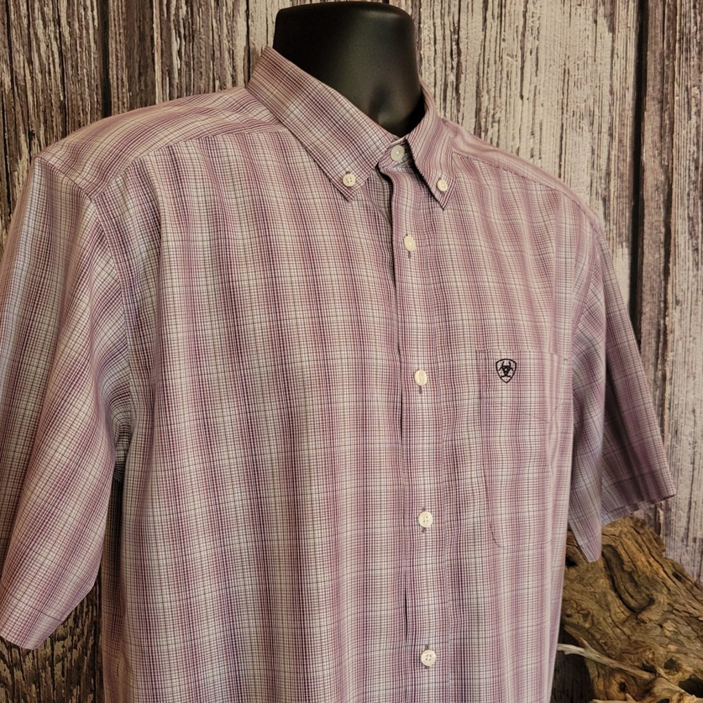 Close-up of the purple plaid striped shirt with embroidered Ariat logo on the pocket.