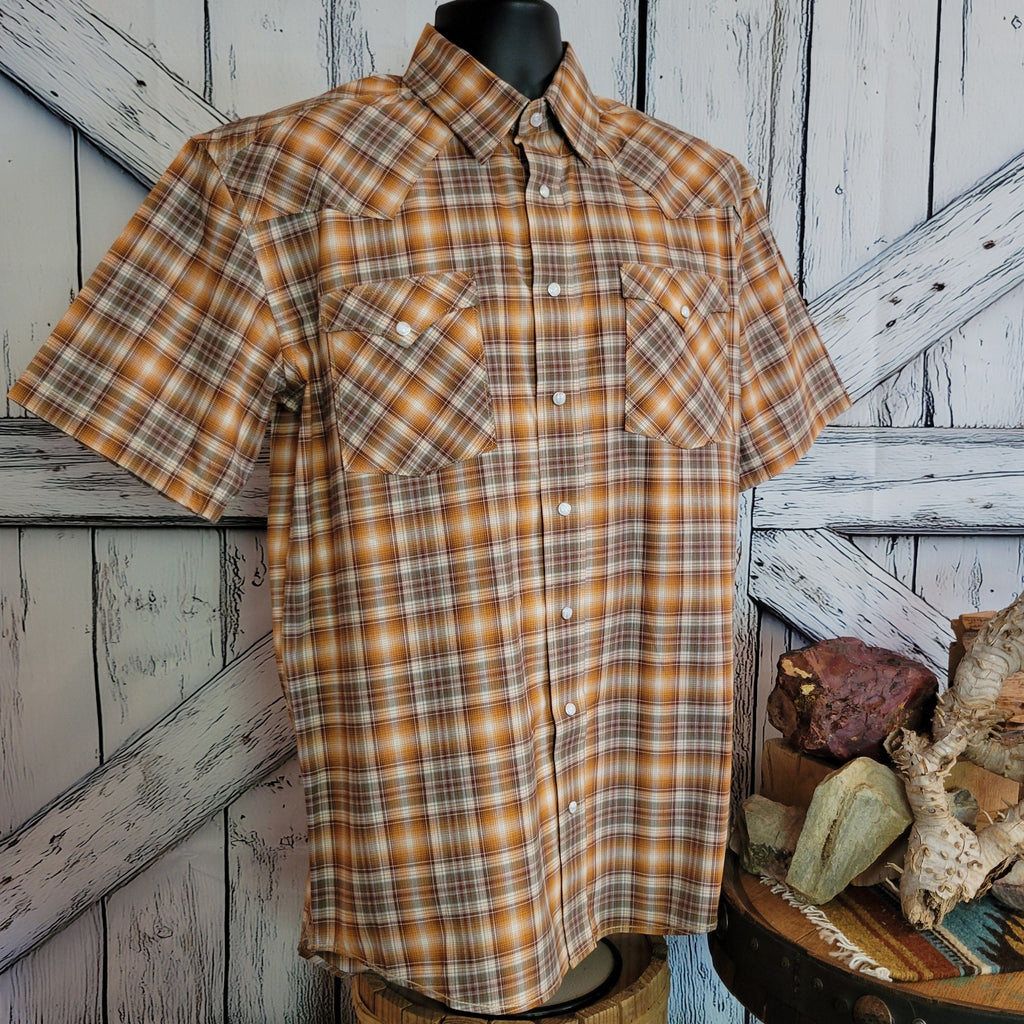 Plaid shirt with button front closure and dual pockets.