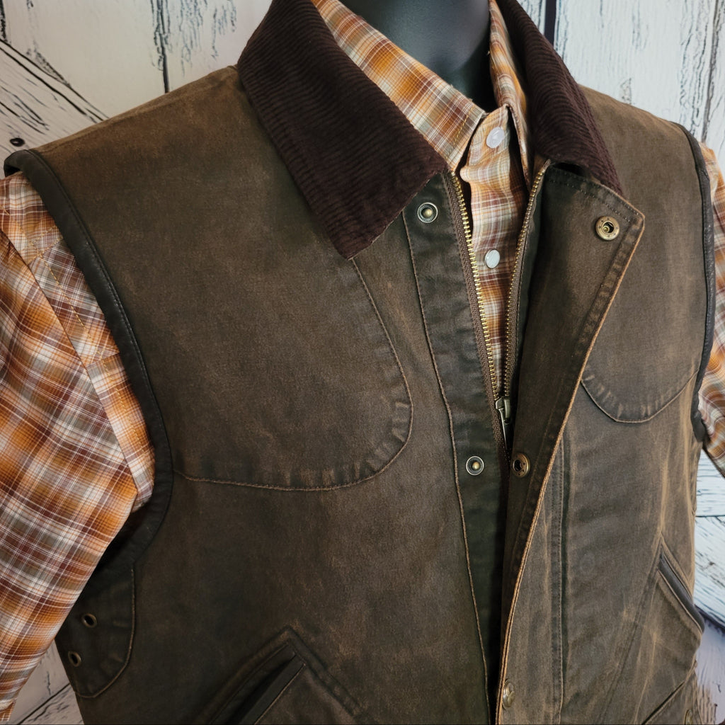 Close-up of the vest’s corduroy collar and snap front with zipper.