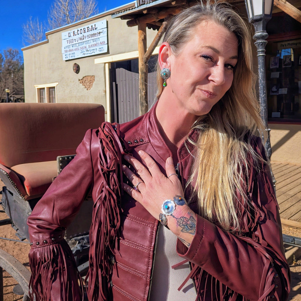 Model wearing a Lainey Wilson red leather jacket from Liberty Wear, front view