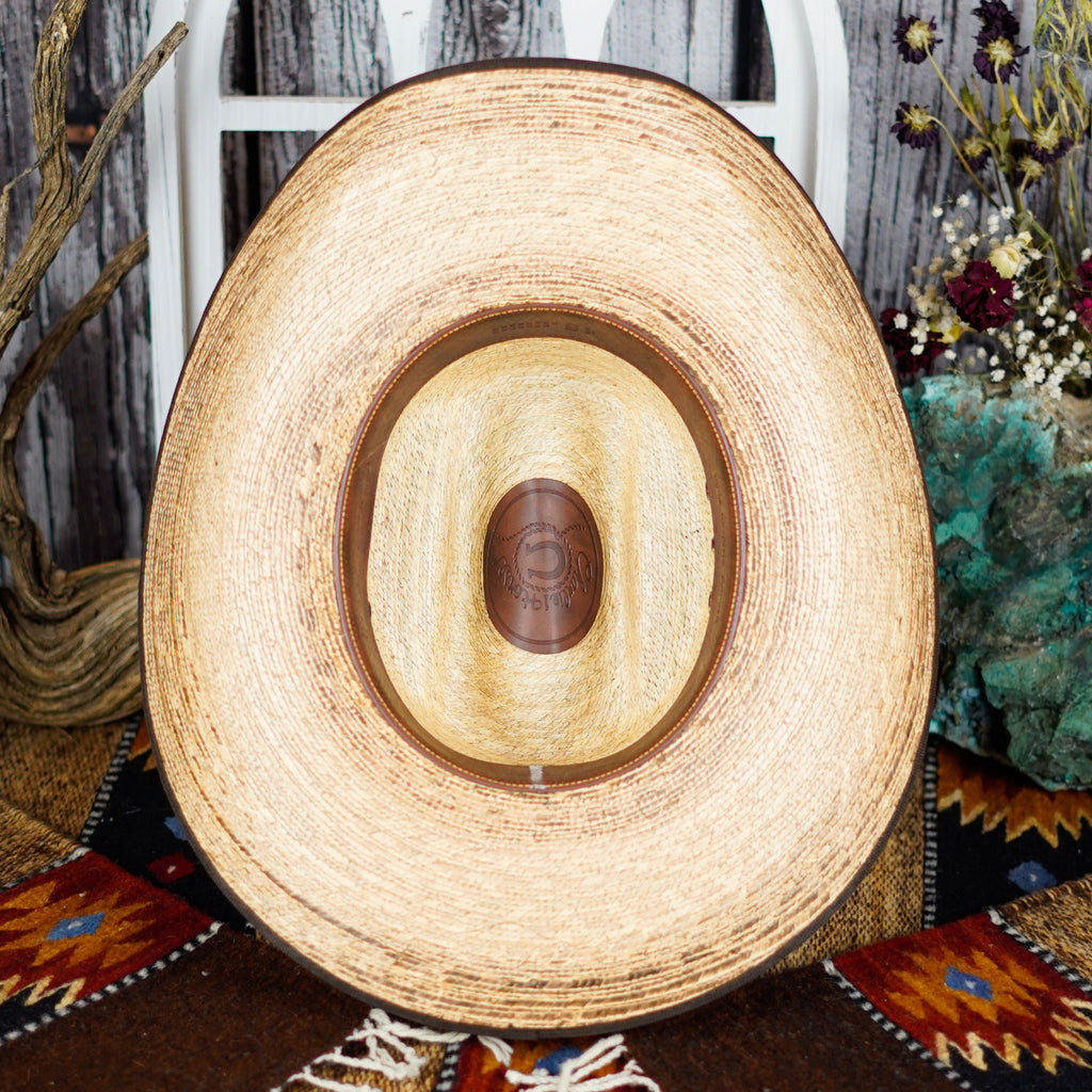 The inside view showcases the brown sweatband and logo on the inside of the crease.